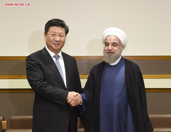 Chinese President Xi Jinping (L) meets with Iranian President Hassan Rouhani in New York, the United States, Sept. 28, 2015. [Photo/Xinhua]