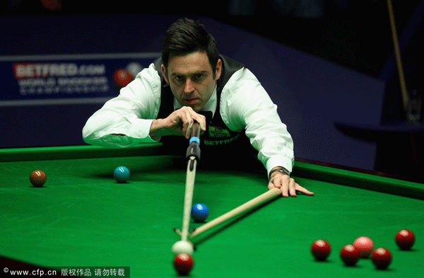 Ronnie O'Sullivan of England in action against Allister Carter of England during the final of the Betfred.com World Snooker Championship at the Crucible Theatre on May 6, 2012 in Sheffield, England.