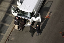 Emergency services personnel inspect a van that has been declared a "suspicious vehicle" near Times Square in New York December 30, 2009.