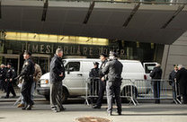 New York Police Department officers inspect a van that has been declared a "suspicious vehicle" and has caused numerous building evacuations and street closures near Times Square in New York December 30, 2009.