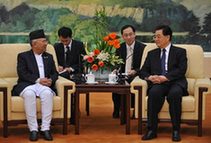 Chinese President Hu Jintao (R, front) meets with visiting Nepali Prime Minister Madhav Kumar Nepal (L, front) in Beijing, Dec. 30, 2009. (Xinhua/Rao Aimin)