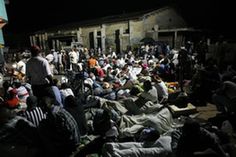 Residents sleep in the street after an earthquake in Port-au-Prince January 13, 2010. The 7.0 magnitude quake rocked Haiti, killing possibly thousands of people as it toppled the presidential palace and hillside shanties alike and leaving the poor Caribbean nation appealing for international help.[Xinhua/Reuters]