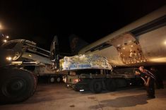 Workers unload the rescue and relief goods from China at the airport in Port-au-Prince, Haiti, on Jan. 17, 2010. The goods weigh about 90 tons, and are worth about 13 million Chinese yuan(about 1.9 million U.S. dollars), including drugs, tents, portable lamps, water purifying equipments, food and water, and clothing. (Xinhua/Xing Guangli)