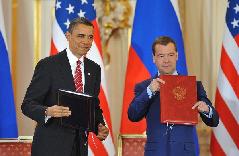 U.S. President Barack Obama (L) and his Russian counterpart Dmitry Medvedev sign a landmark nuclear arms reduction treaty in Prague, capital of Czech Republic on April 8, 2010. [Wu Wei/Xinhua] 