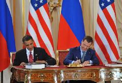 U.S. President Barack Obama (L) and his Russian counterpart Dmitry Medvedev sign a landmark nuclear arms reduction treaty in Prague, capital of Czech Republic on April 8, 2010. [Wu Wei/Xinhua]