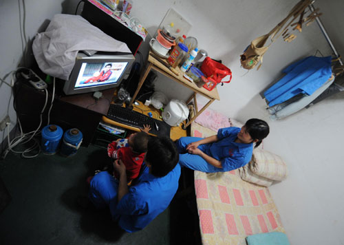 The family of three in their 10-sq-m home in Hangzhou, East China's Zhejiang province, May 25, 2010. 