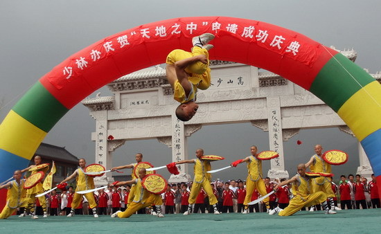 Martial arts performers celebrate the Shaolin Temple becoming part of a world heritage site on August 1, 2010. 