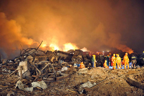 Firemen and rescuers work on the site of a fireworks factory explosion in Yichun of Northeast China's Heilongjiang province late into the night on August 16, 2010. 