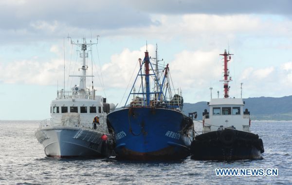 The detained Chinese fishing trawler is flanked by two Japanese Coast Guard vessels during an investigation by Japanese authorities near Ishigaki Island in Okinawa Prefecture of Japan Sept. 12, 2010. The detained Chinese fishing trawler is flanked by two Japanese Coast Guard vessels during an investigation by Japanese authorities near Ishigaki Island in Okinawa Prefecture of Japan Sept. 12, 2010.
