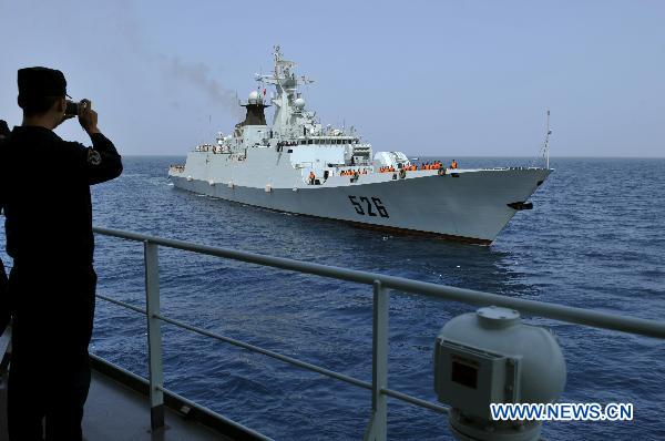 The missile frigate &apos;Wenzhou&apos; of China&apos;s eighth escort flotilla, is seen sailing on the Gulf of Aden, March 18, 2011. China&apos;s eighth escort flotilla took over on Friday the escort mission from China&apos;s seventh escort flotilla to protect merchant ships from rampant piracy in the area. [Xinhua] 