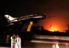 Fire and smokes erupt from a Pakistan's military air base after an attack by militants in southern Pakistan's Karachi on May 23, 2011. 
