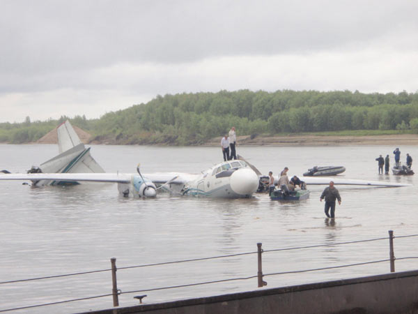 The damaged AN-24 plane, owned by the Angara Airlines, is seen after a hard landing on the surface of the Ob river in Tomsk region in western Siberia July 11, 2011. The plane, which flew from Tomsk to Surgut, had 37 people onboard. The damaged AN-24 plane, owned by the Angara Airlines, is seen after a hard landing on the surface of the Ob river in Tomsk region in western Siberia July 11, 2011. The plane, which flew from Tomsk to Surgut, had 37 people onboard.