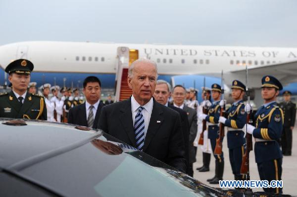 The Vice President of the United States Joseph Biden (front) arrives in Beijing, capital of China, on Aug. 17, 2011. [Li Xueren/Xinhua] 