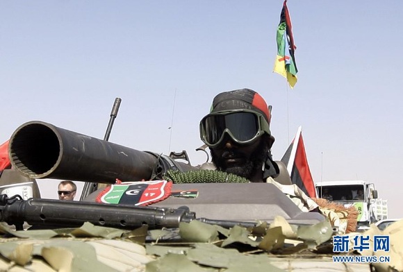 Armed forces of the Libya's National Transitional Council in drive tanks on Sept. 17, 2011. 