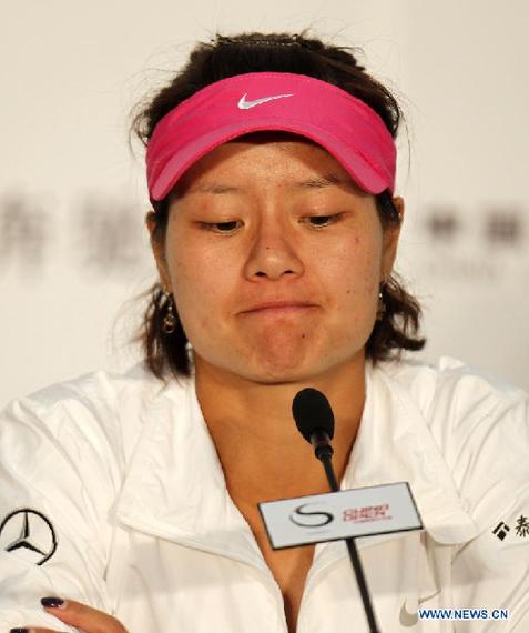 Li Na of China attends the press conference after the first round of women's singles against Monica Niculescu of Romania at 2011 China Open Tennis Tournament in Beijing, China Oct. 2, 2011. Li Na Lost 4-6, 0-6. [Wang Lili/Xinhua] 