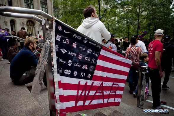 A flag is seen near Wall Street in New York, the United States, Oct. 2, 2011.[Fan Xia/Xinhua]