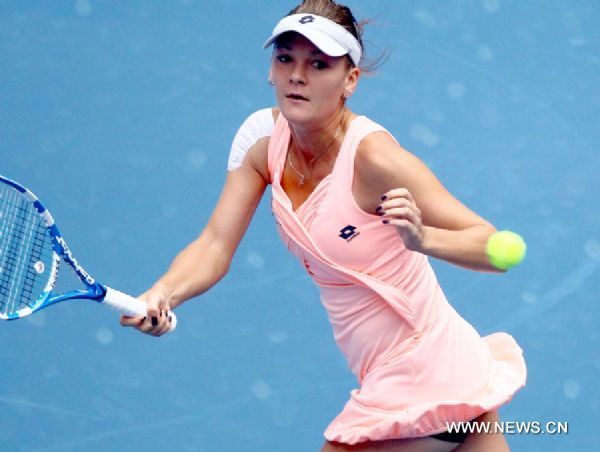 Poland's Agnieszka competes during the women's singles quarterfinal against Serbia's Ana Ivanovic at 2011 China Open Tennis Tournament in Beijing, capital of China, on Oct. 7, 2011. Radwanska advanced to the semifinal after Ivanovic called off the match. [Chen Jianli/Xinhua]