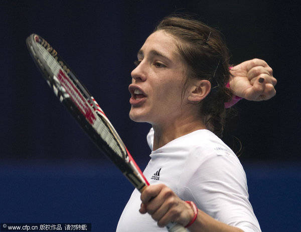 Germany's Andrea Petkovic celebrates after she defeated Monica Niculescu of Romania in their singles semifinal match of the China Open Tennis Tournament in Beijing, Saturday, Oct. 8, 2011.