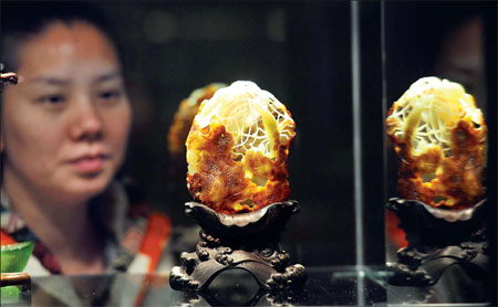 The price of fine nephrite, just natural stone, has climbed from 10,000 yuan a kilogram to at least 1 million in 10 years. Top-grade art work in Hetian jade? Possibly priceless. An exhibit of works such as this in Beijing ended this week. [Provided to China Daily]