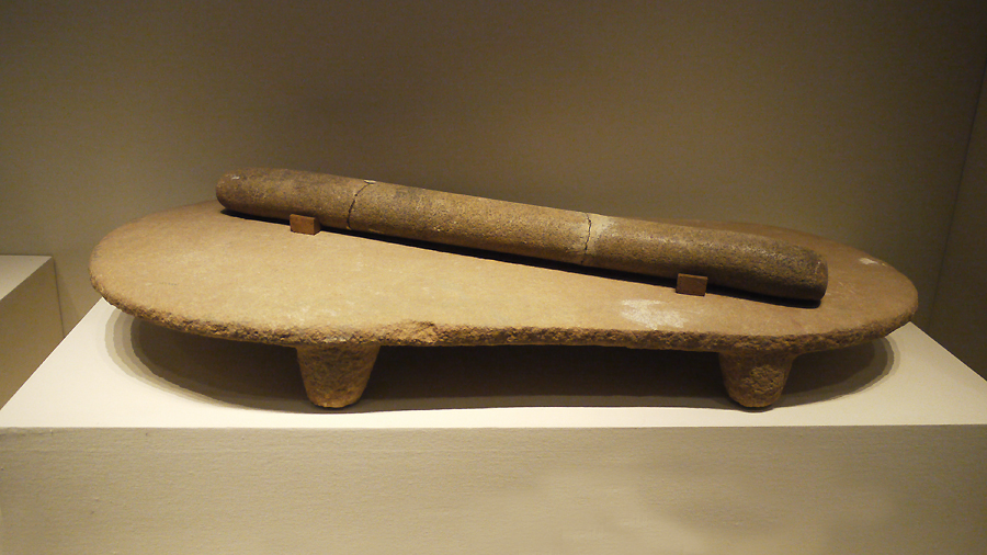 Stone Quern and Roller, Peiligang Culture (c. 6100-5000 BC), unearthed at Peiligang, Xinzheng, Henan Province, 1978. It is exhibited in the section of Life and Production in Neolithic China, an exhibition of Ancient China in the National Museum of China. [Photo by Xu Lin / China.org.cn]