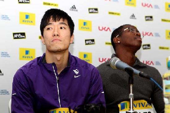 China's hurdler star Liu Xiang (L) and Dayron Robles attend a press conference in Birmingham, Britain, Feb. 17, 1012. Liu Xiang disclosed on Friday that this summer's London Games 'should be' his last Olympic show. [Xinhua]