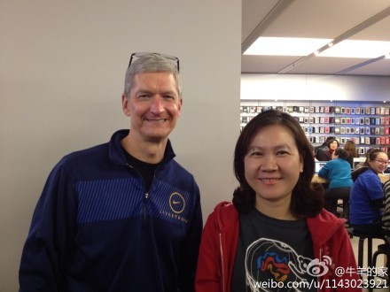 A photo of Apple CEO Tim Cook and a customer posted online. [File photo]