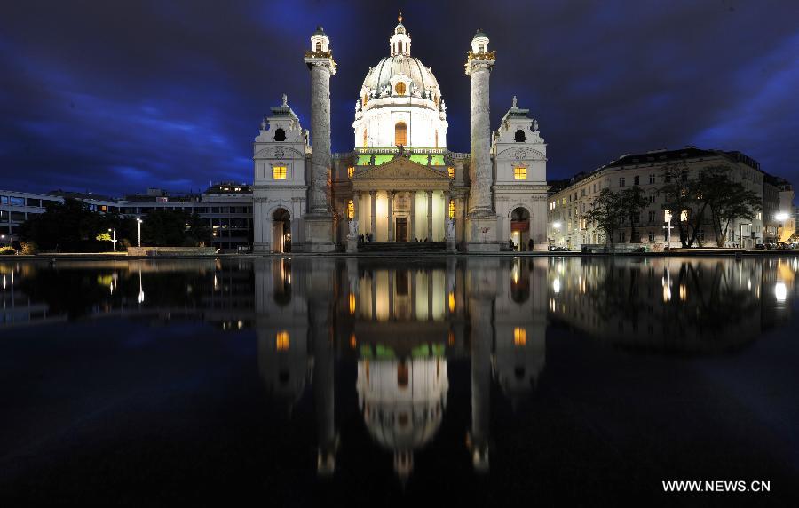 The St. Charles's Church is seen at night in Vienna, Austria, May 5, 2012. The church, built in 1737, is one of the most outstanding baroque church structures, and boasts a dome in the form of an elongated ellipsoid. (Xinhua/Xu Liang) 