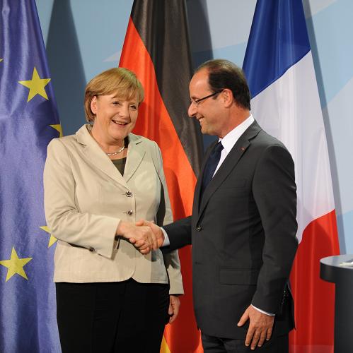 German Chancellor Angela Merkel(L) shakes hands with the French left-wing new president Francois Hollande(R) on Tuesday.