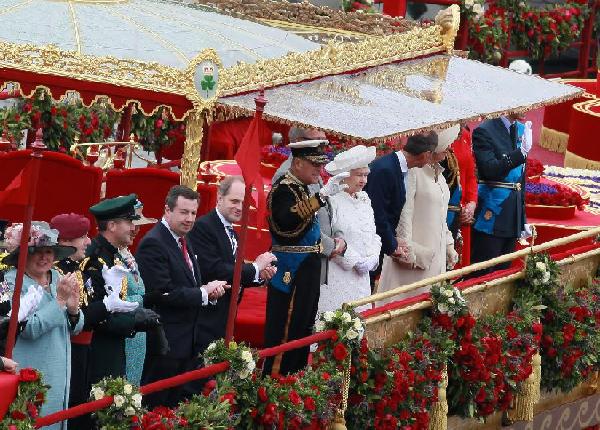 British Queen Elizabeth II is seen on the barge the Spirit of Chartwell during her Diamond Jubilee Pageant on River Thames in London, Britain, June 3, 2012. The Queen on Sunday took part in the largest event held to celebrate her 60 years as queen by leading a flotilla of boats in a pageant down River Thames through central London. [Xiang Mei/Xinhua] 