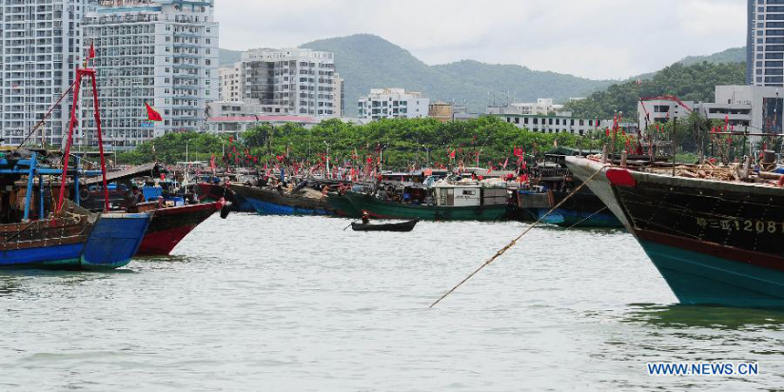 Photo taken on Aug. 1, 2012 shows the fishing boats being berthed at the harbor in Sanya, south China&apos;s Hainan Province. As the two-and-half-month summer fishing moratorium in the South China Sea ended Wednesday, fishing boats will be back to work. 