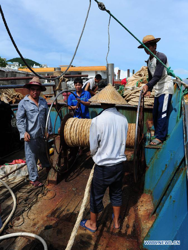 Fishermen get prepared for going out to sea for fishing in Sanya, south China&apos;s Hainan Province, Aug. 1, 2012. As the two-and-half-month summer fishing moratorium in the South China Sea ended Wednesday, fishing boats will be back to work.