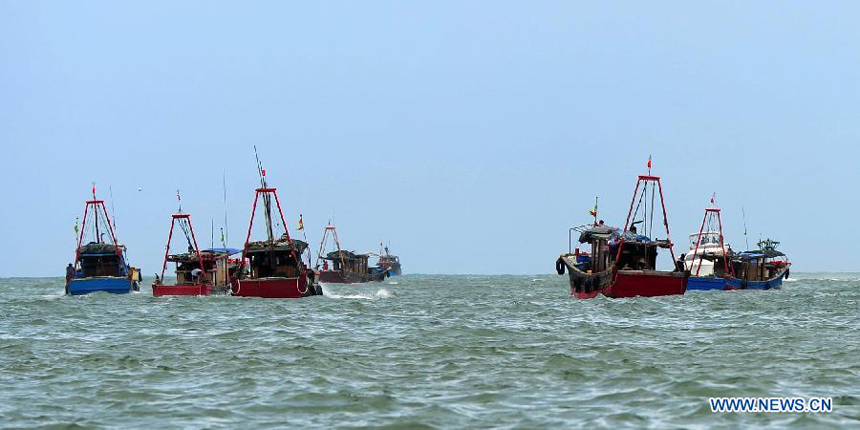 Photo taken on Aug. 1, 2012 shows the vessals going to sea for fishing in Sanya, south China&apos;s Hainan Province. As the two-and-half-month summer fishing moratorium in the South China Sea ended Wednesday, fishing boats will be back to work. 