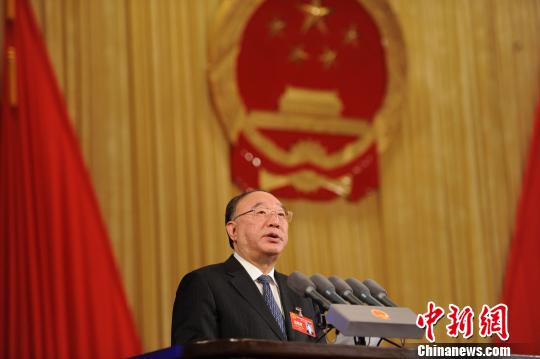 Huang Qifan, mayor of Chongqing, delivers a report on the work of the municipal government, at the opening of the 4th Chongqing Municipal People's Congress, Jan. 26.