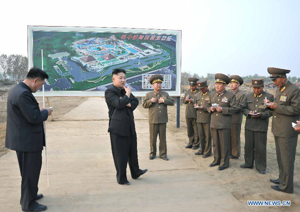The photo provided by KCNA on May 7, 2013 shows top leader of the Democratic People's Republic of Korea (DPRK) Kim Jong Un (2nd L) inspecting construction projects built by the Korean People's Army on May 6, 2013.