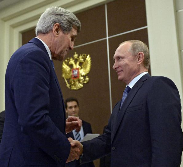 Russian President Vladimir Putin (R) shakes hands with U.S. Secretary of State John Kerry during their meeting in Sochi, Russia, May 12, 2015. [Photo/Xinhua]