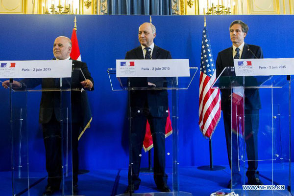 French Foreign Minister Laurent Fabius (C) attends a joint press meeting with Iraqi Prime Minister Haider al-Abadi (L) and U.S. Deputy Secretary of State Antony Blinken in Paris, France, June 2, 2015. French Foreign Minister Laurent Fabius said on Tuesday the fight against Islamic State (IS) militants in Iraq would be longer than anticipated, reiterating the coalition countries' determination to eradicate the Islamist threat in the region. [Photo/Xinhua]