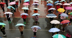 Zaozhuang,Shandong: Students from the Hui ethnic primary school stand in formation in remembrance of the dead in Yushu prefecture of China’s Northwest Qinghai province on April 21, 2010. 